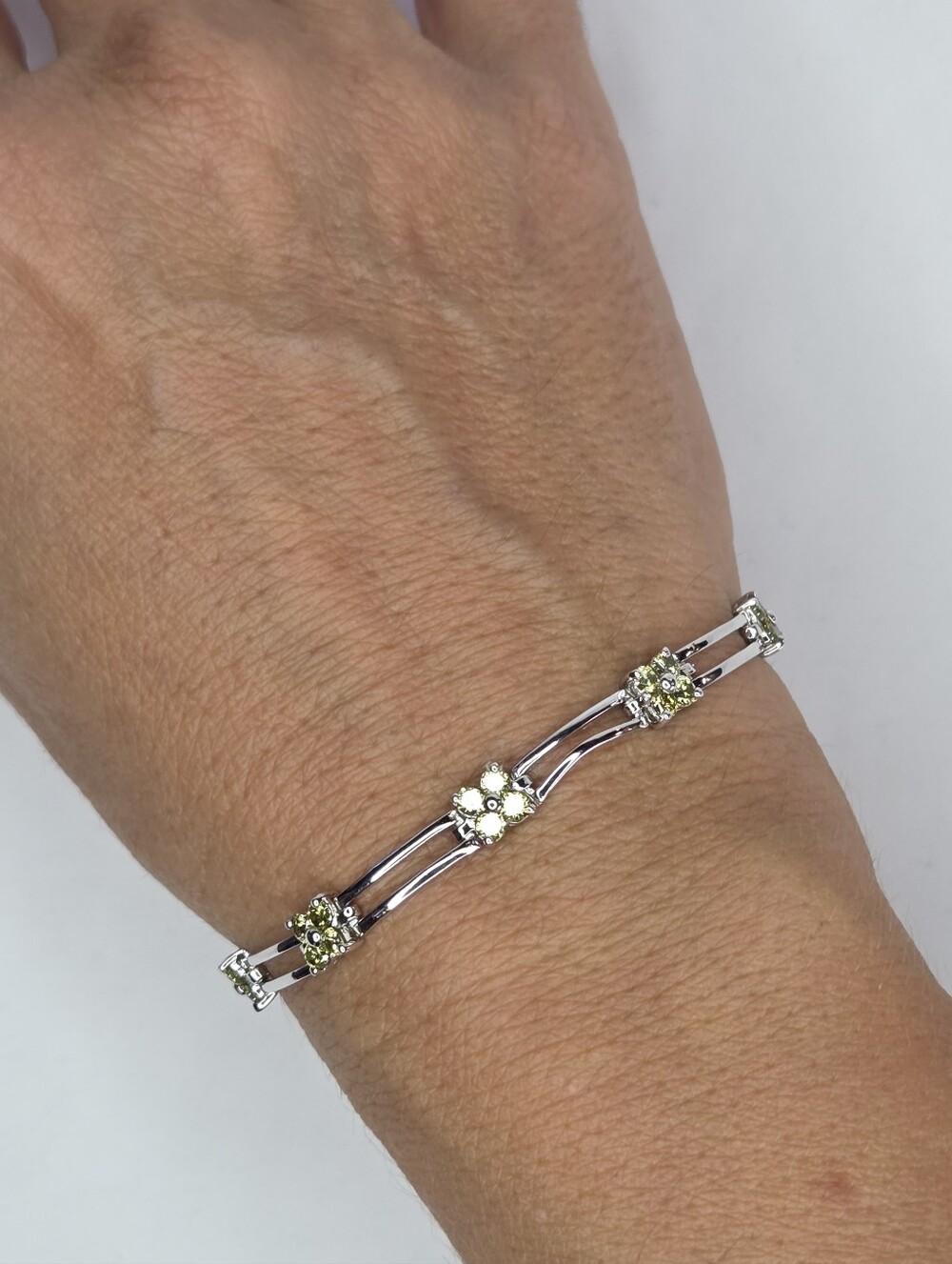 Sterling Silver Floral Link Bracelet with Light Green Stones
